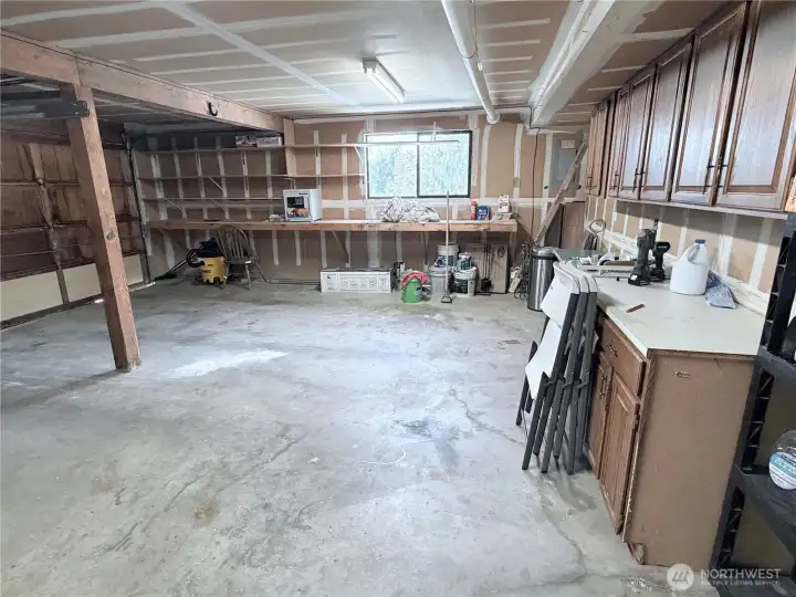 2 car garage with lots of storage and work space