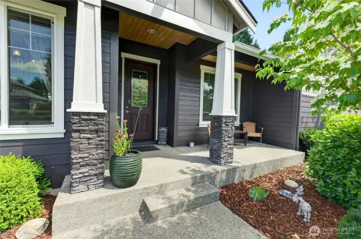 Welcoming covered front porch creates a warm first impression for guests and visitors.