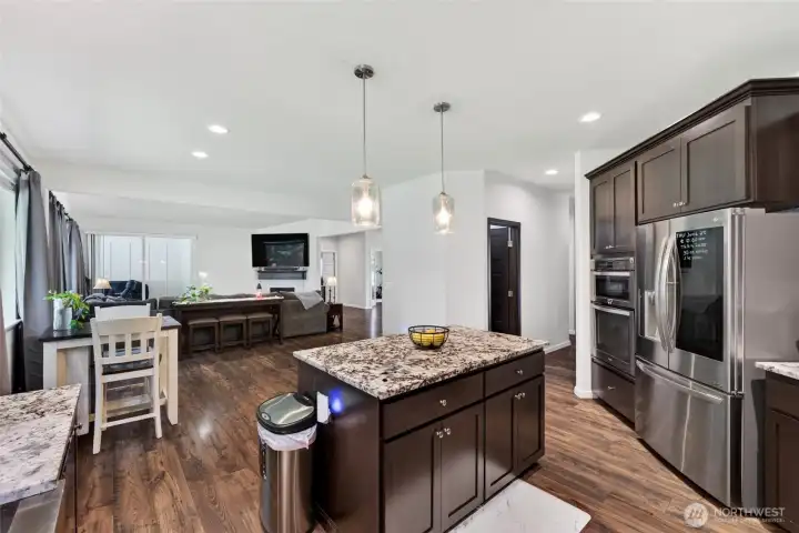 Open-concept design seamlessly connects the kitchen to the living spaces, creating the ideal layout for entertaining and everyday living.