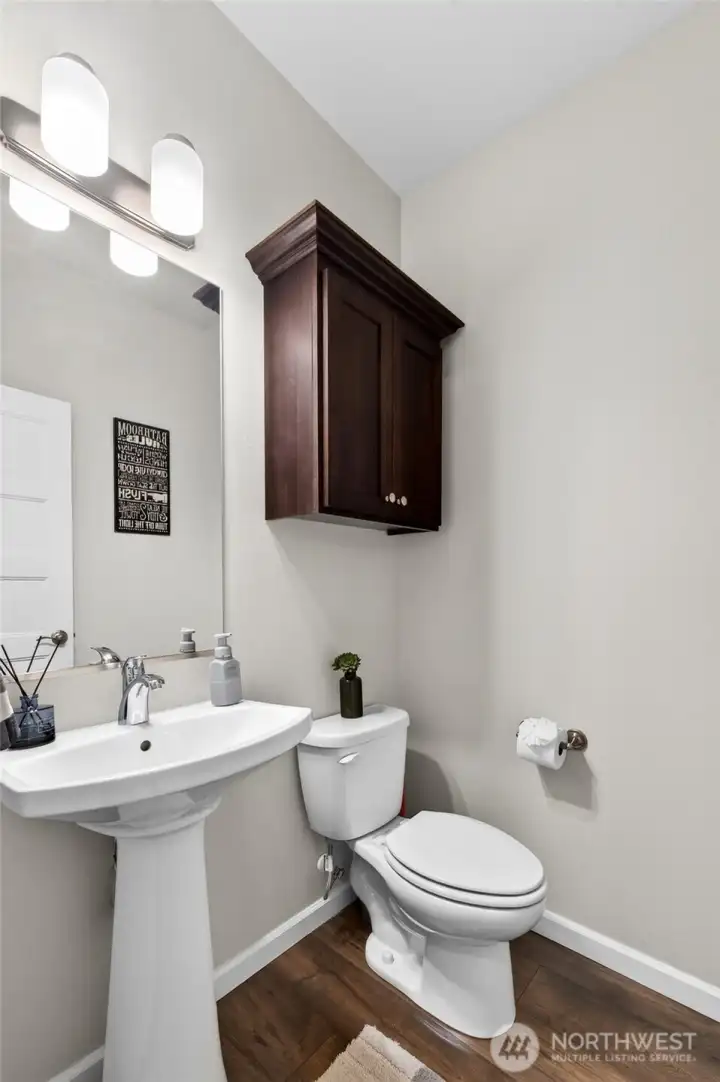 Convenient powder room offers added comfort and accessibility for guests.