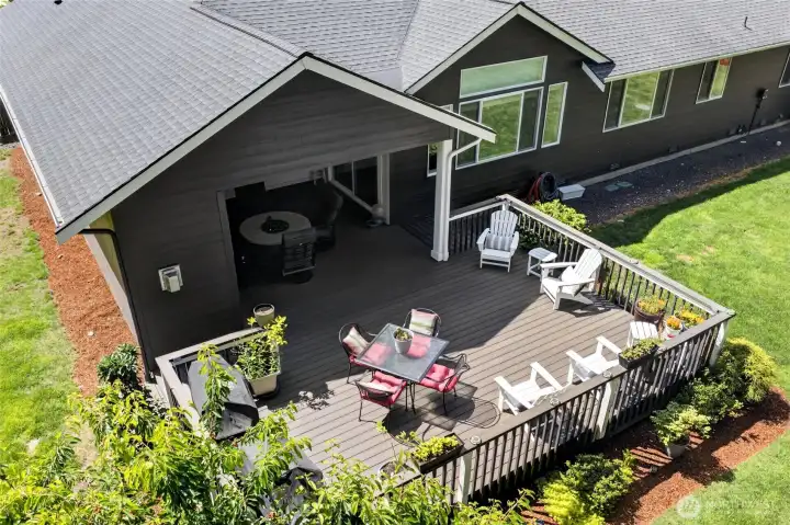 Large composite deck seamlessly connects open-air entertaining with covered year-round outdoor living.