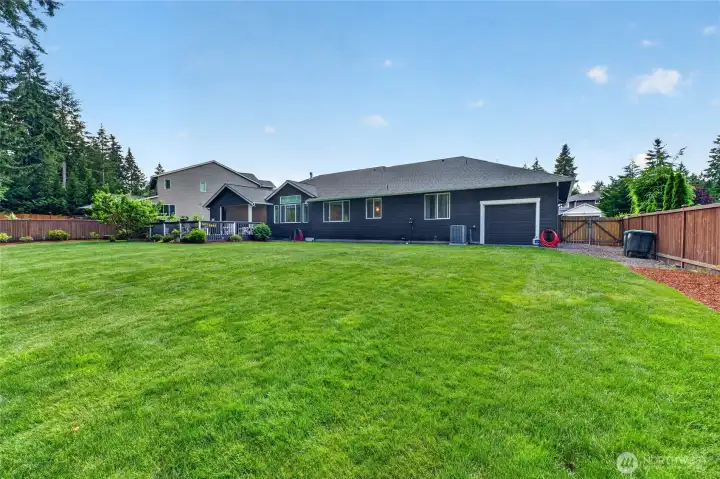 Rare oversized backyard offers endless possibilities for recreation, entertaining, gardening, and outdoor enjoyment.