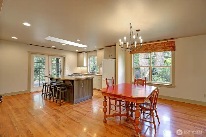 Open concept dining room & kitchen with eat-at island. Open concept dining room & kitchen with eat-at island.