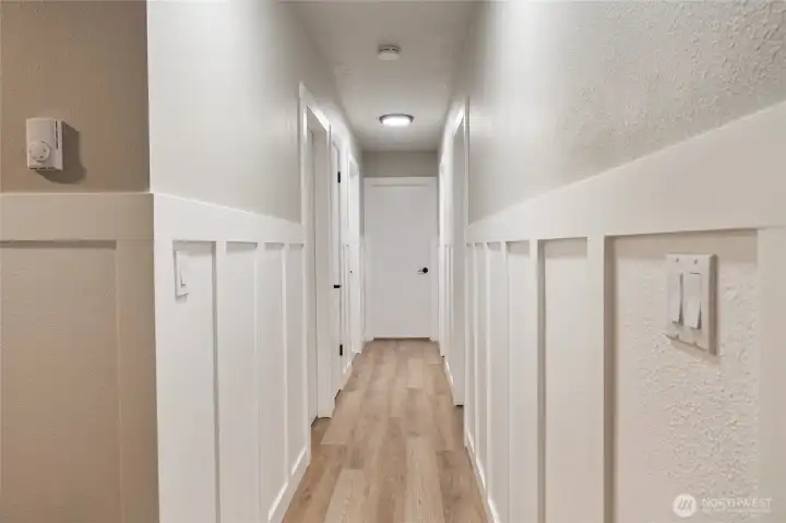 Hallway with wainscotting - so many thoughtful touches like this have been added in the home.