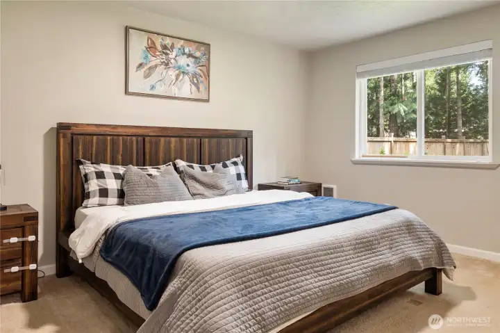Primary suite fits a king size bed plus more!