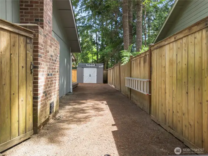Gates open both sides to pull through to the side of the home.