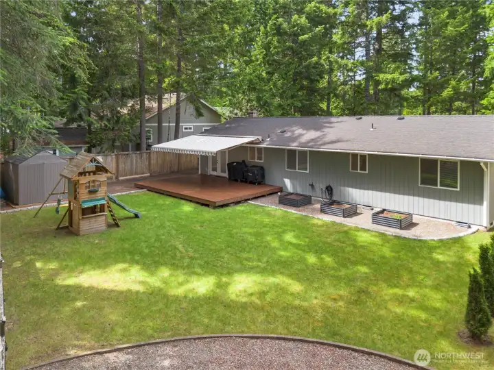 Backyard - fully fenced and ready for you! Still time to put your tomato plants in the raised garden beds.