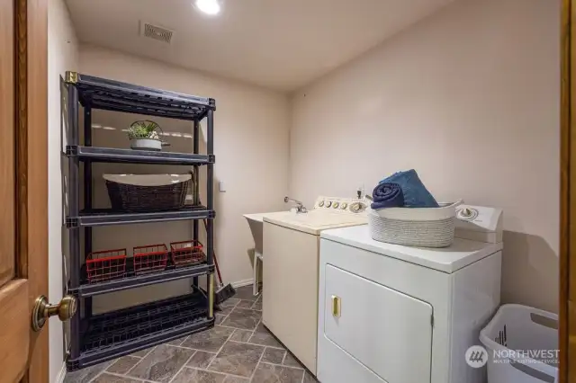 Laundry room is conveniently located on the first floor.