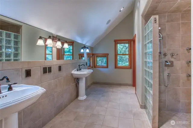 Add a beautiful dresser between these pedestal sinks for custom bathroom storage.