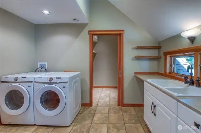 A large laundry room is conventiently located on the primary bedroom floor. No longer will you be hauling hampers of clothes around the house!