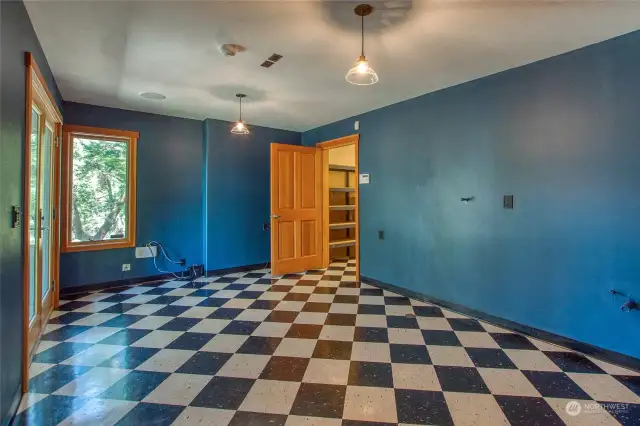 Additional room in daylight basement with roughed in plumbing and exterior door and a door leading to lower pantry.