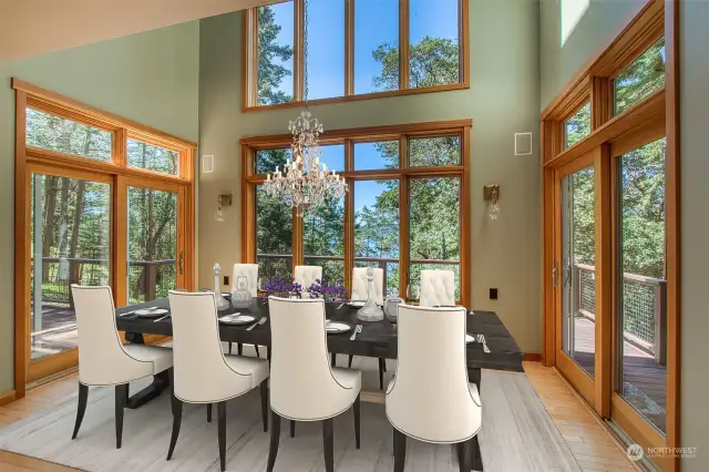 The vaulted dining area is saturated in light and works as a centerpiece for the room. A new chandelier is on the way for installation! (Virtual Staging)