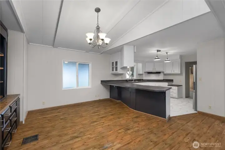 View from living room into dining room and kitchen - large space!