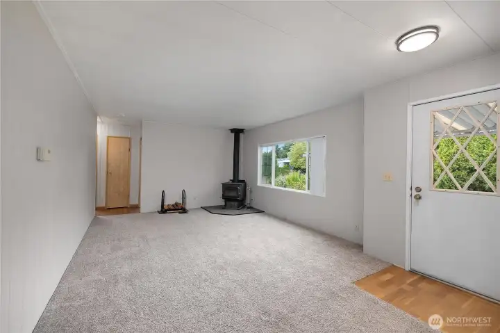 Entryway door to right leading into 2nd living space with wood burning fireplace!