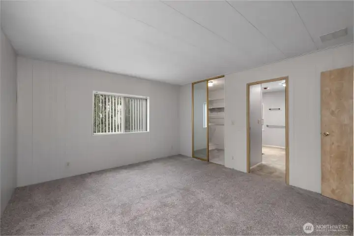 View from primary bedroom into primary en-suite bathroom and large walk in closet!