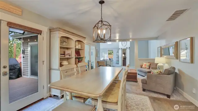 Kitchen with eating space, access to back yard and views of the gorgeous green space