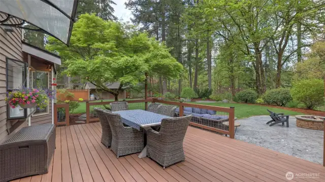 From the back deck looking toward the expansive backyard and green space.