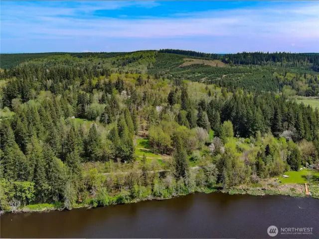 View of the property facing E.  The access to the lakefront area is to the left.