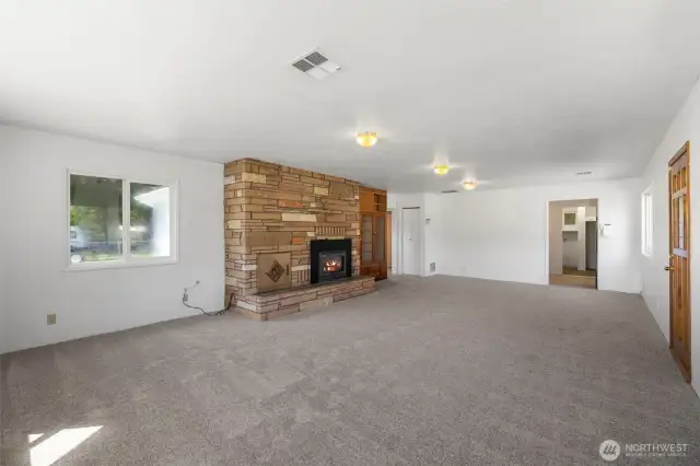 Beautiful stone fireplace will keep you cozy in winter.