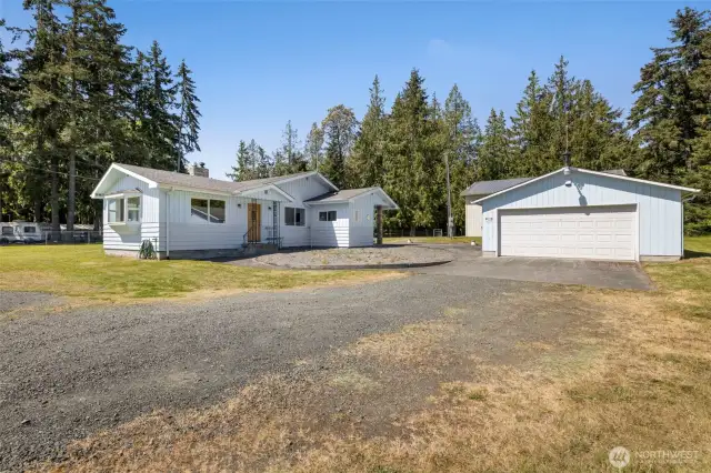 Your garage and shop are within steps of this charming home!