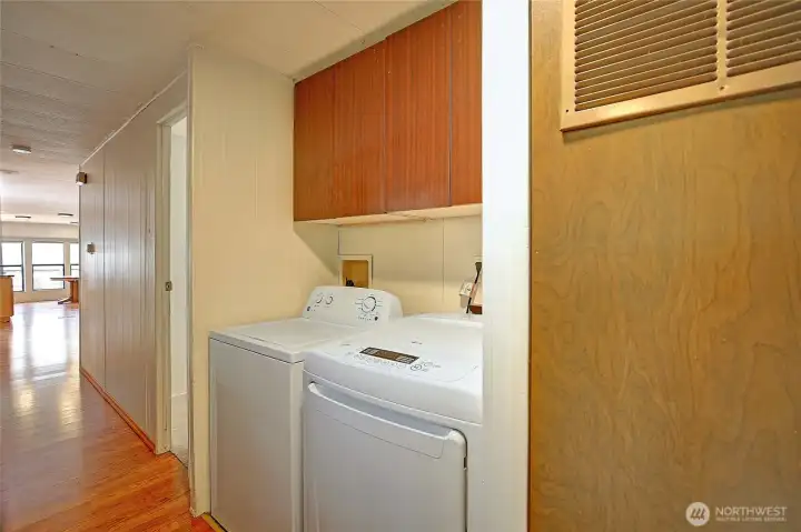 Hallway storage and laundry space.