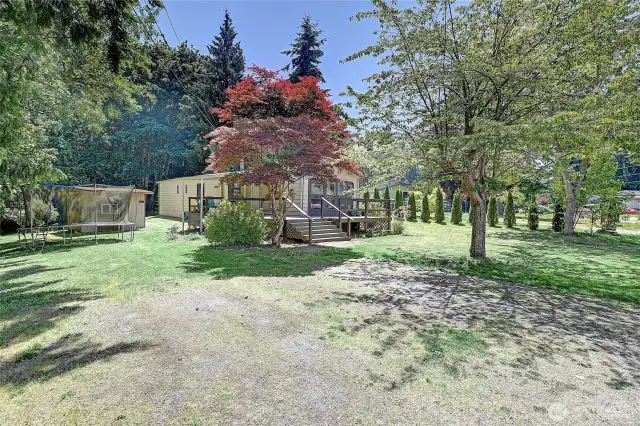Beautiful, mature trees, plenty of room for gardening, lawn games, etc!