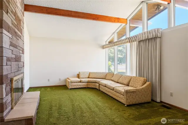 Spacious living room with open beam vaulted ceiling