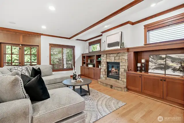 Cozy up by the fireplace in the open-concept great room with built-ins and casual dining—ideal for everyday living.