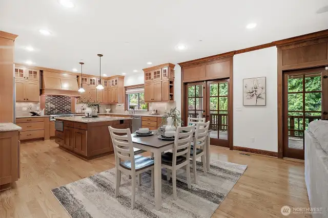 French doors open to a covered, heated deck—perfect for outdoor dining and relaxing in any season.