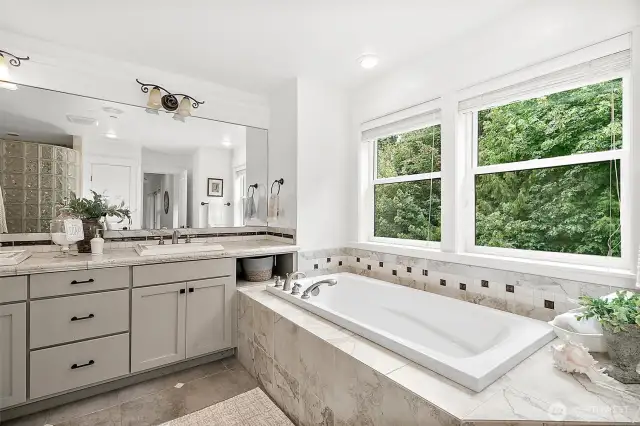 Bathed in natural light, this spa-inspired bath offers luxury and serenity in every detail.