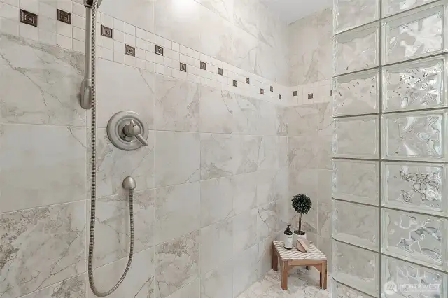 Spacious and beautifully designed, this doorless shower combines modern style with everyday comfort.