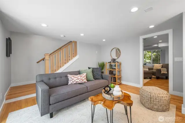Lower level has been transformed, adding hardwood floors and creating an entire suite on the lower level with 2 bedrooms, full bath, storage and studio-work out space.