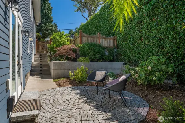 The door go out to the circular patio in the fully fenced property.