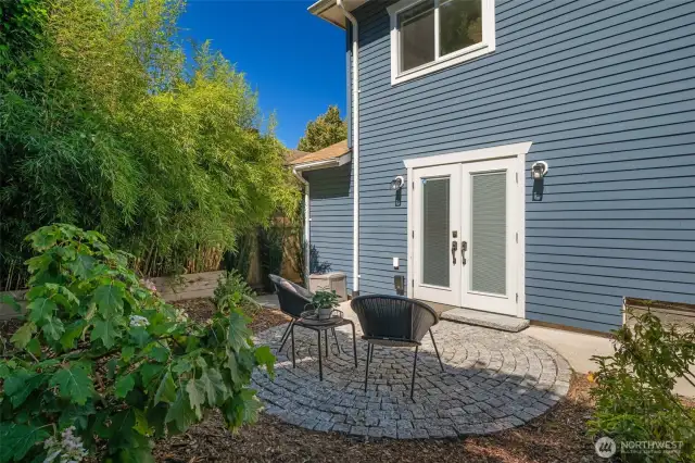 Around the corner is the storage closet, the EV charger and another gate to 52nd Ave. You could park and come around to this back door.