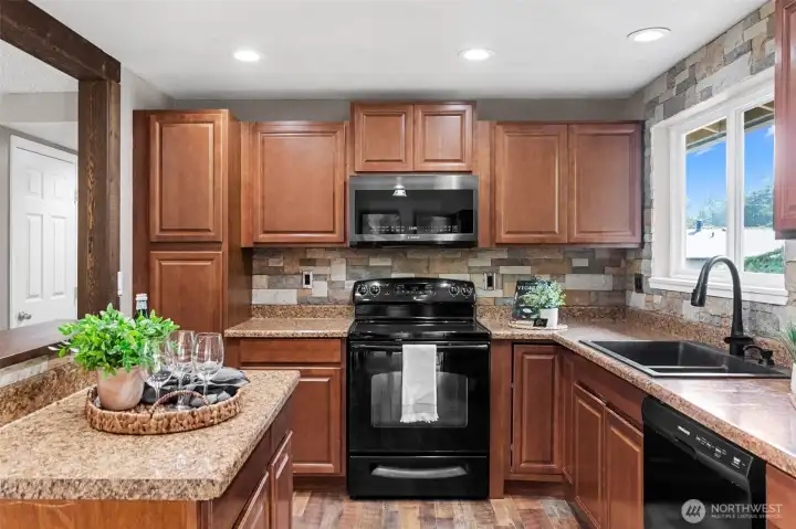 Plenty of counter space and cabinetry are highlights of this kitchen!