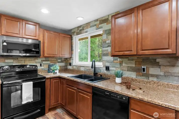 Large window over sink gives you the best views of your big backyard!