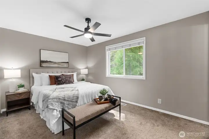 Primary bedroom with recently professionally cleaned carpets throughout.