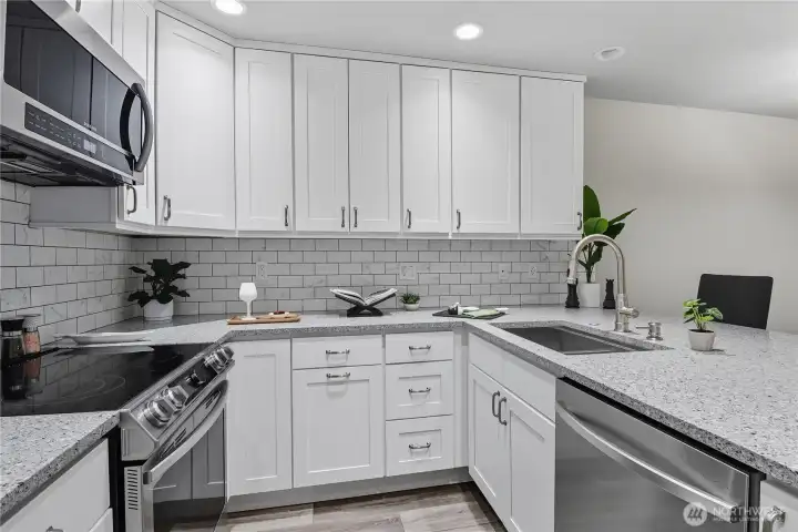 Custom cabinets & extensive recessed lighting.