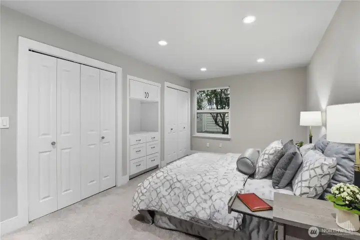 Spacious custom closets, built-in dresser & TV niche.