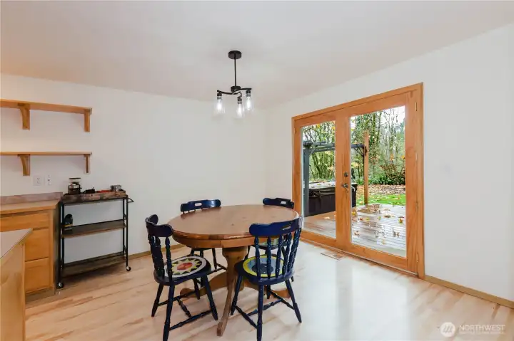 French doors off the dining area open to the deck and backyard.