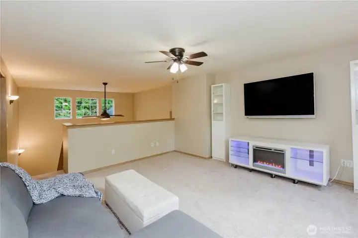 Versatile loft space ideal for media or office.