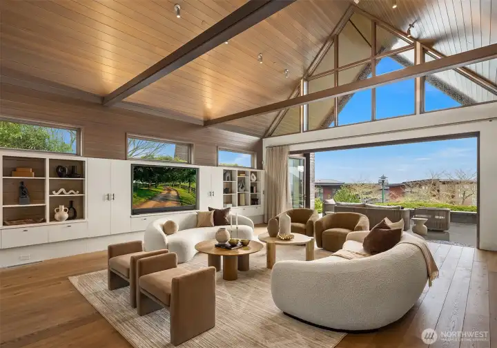 Great room features 30 foot cedar ceiling, wet bar, Accordion glass doors and epic views.