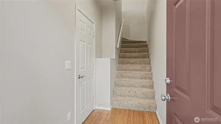 Home enters into the ground floor, garage to the left and living and bedrooms upstairs.