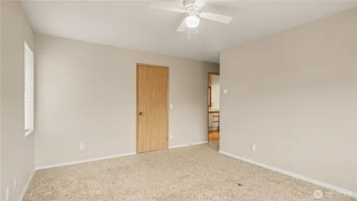 Primary bedroom also features a ceiling fan, great air circulation.