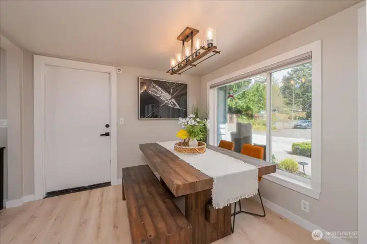 Dining space with window view of yard and 141st St.  WAter feature right outside window. So calming.