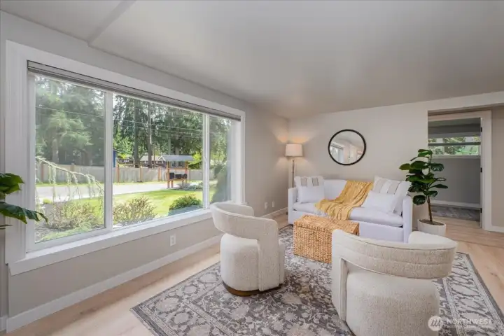 Large living room allows for lots of design options.  Room fills with light to warm it up easily