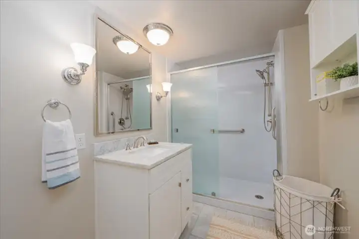 Spacious bathroom with large walk in shower.