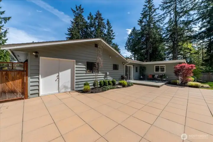 Double doors open to the oversized garage.