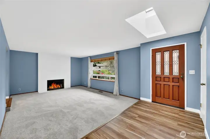 Sunken LIVING ROOM  Large picture window overlooking front yard with wood blinds and curtains  NEW carpet / Easy access to kitchen