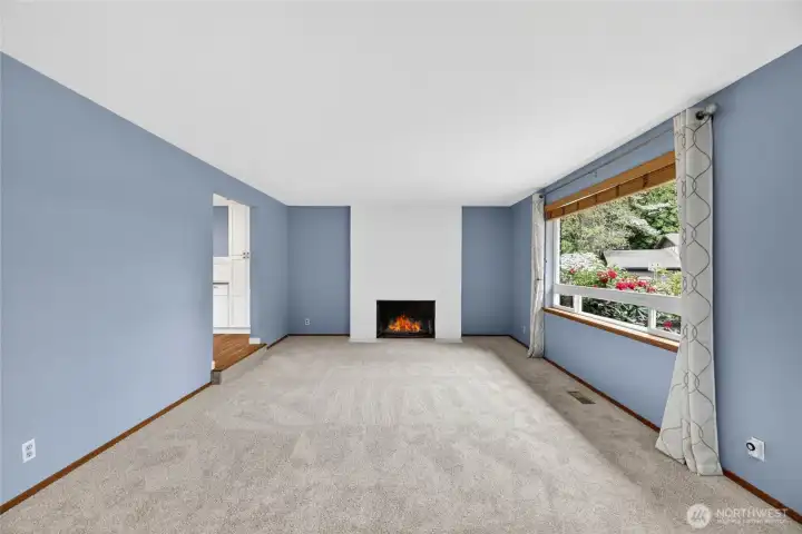Floor to ceiling brick faced wood burning fireplace  Chimney flue was water repellent sprayed in 2025  2nd coat to be completed summer 2026, at no cost to new owner